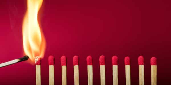Row of matches with one alight
