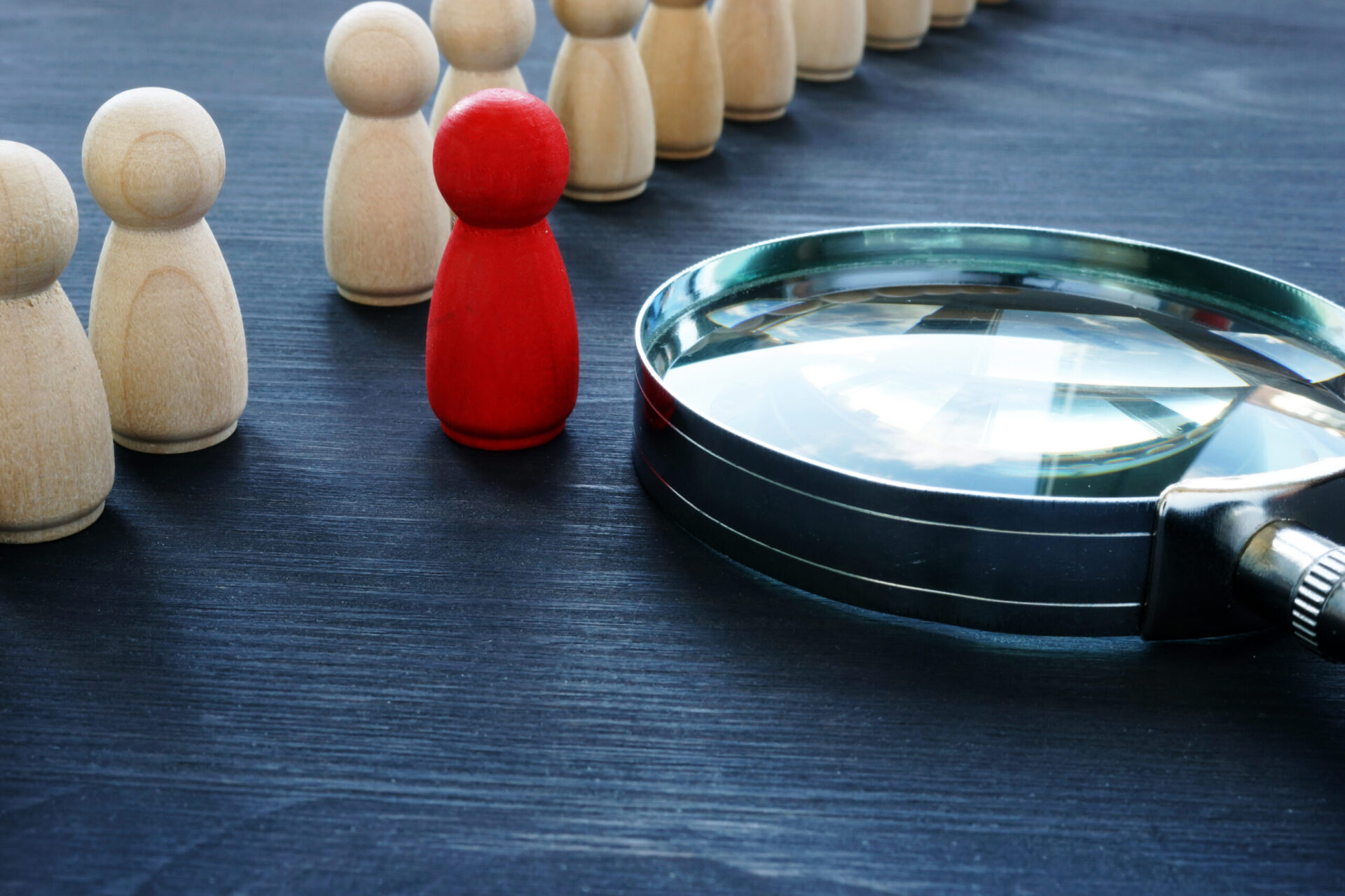 Photo of a magnifying glass and some game pieces