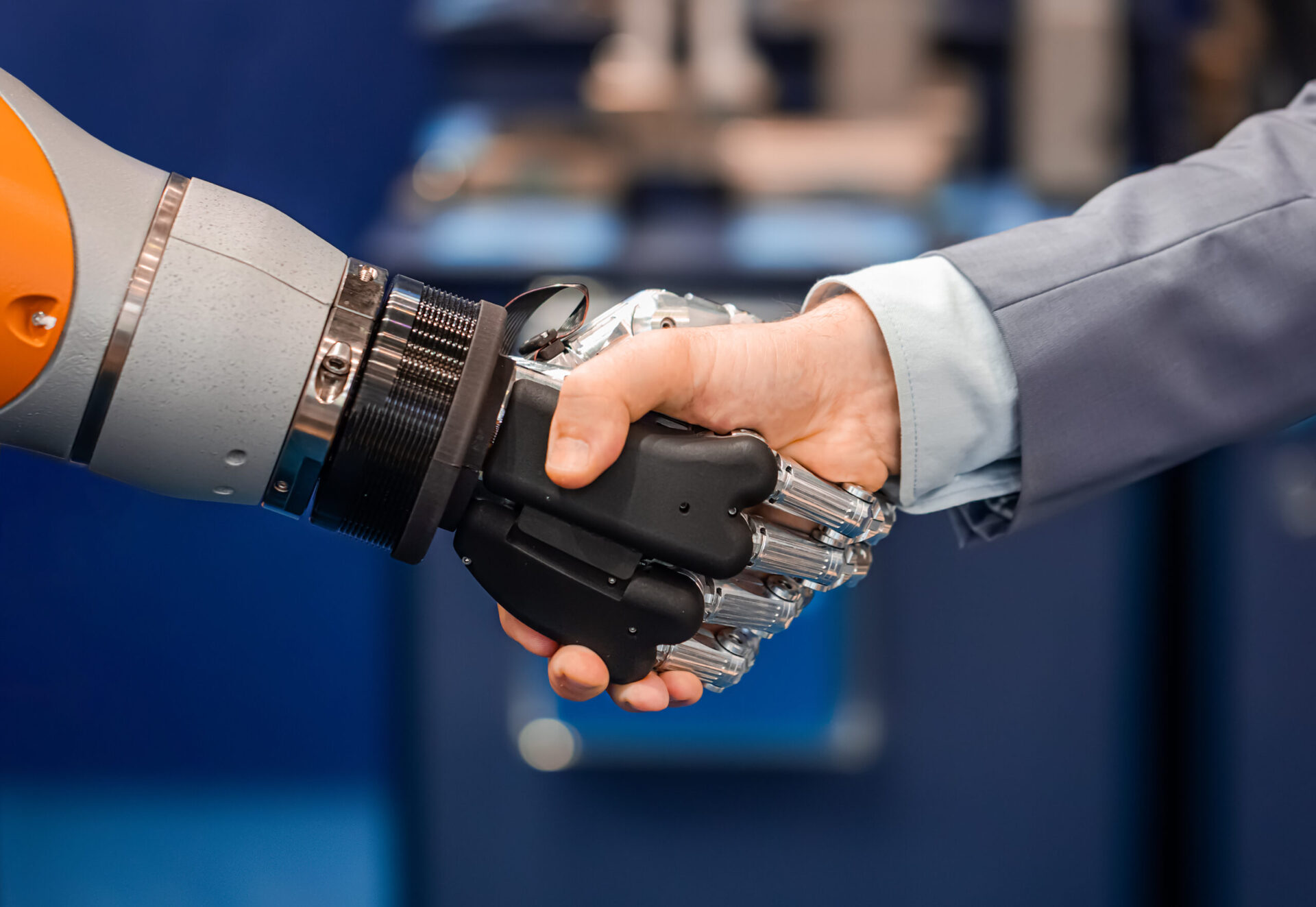 A hand shaking a robot hand