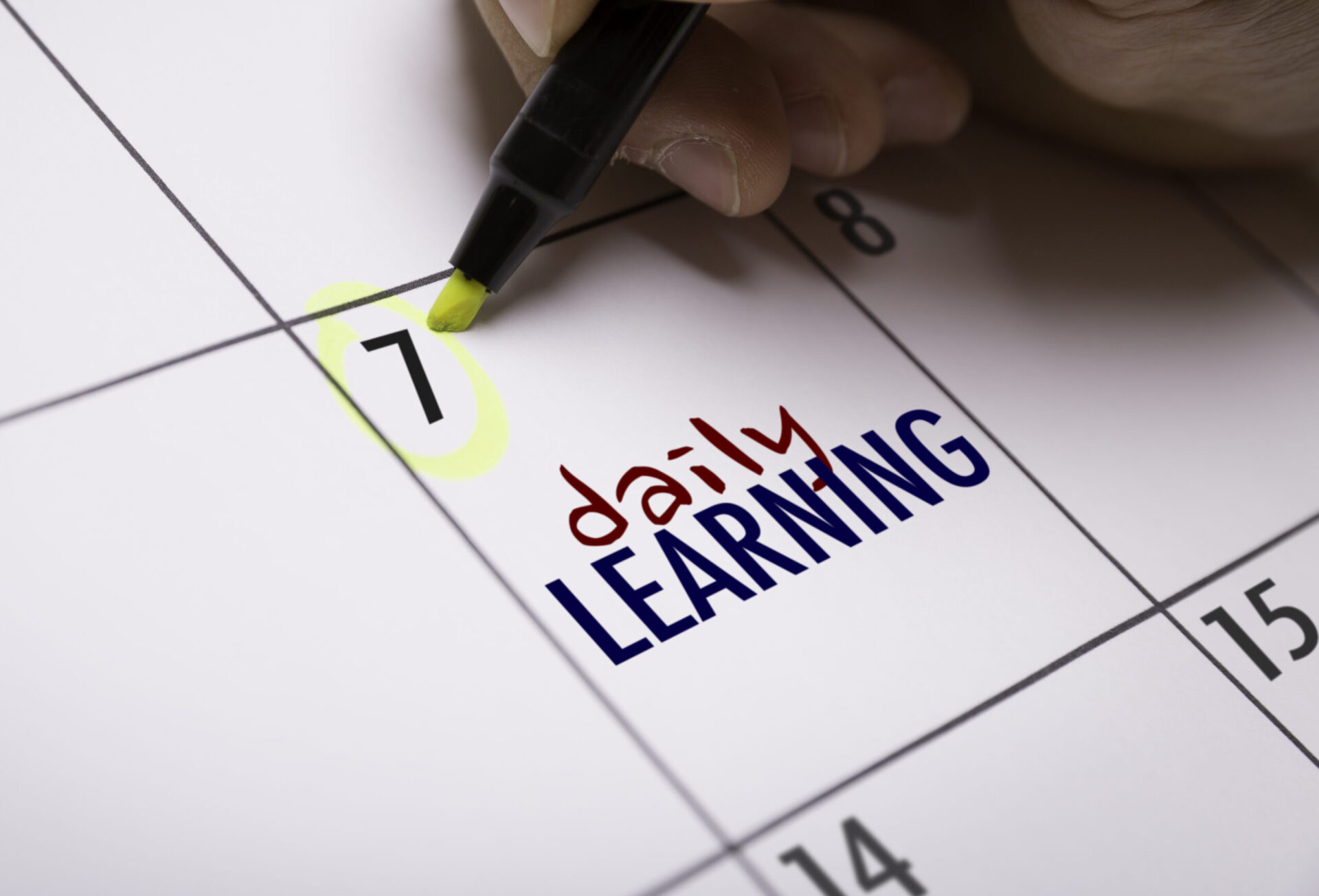 Photo of a calendar with the 7th highlighted and 'daily learning' written