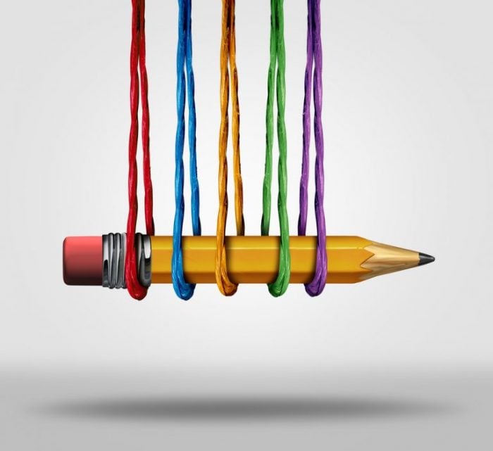 Photo of pencil being held up by coloured string