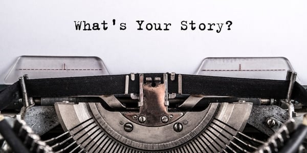 Photo of a typewriter with text of 'what's your story?