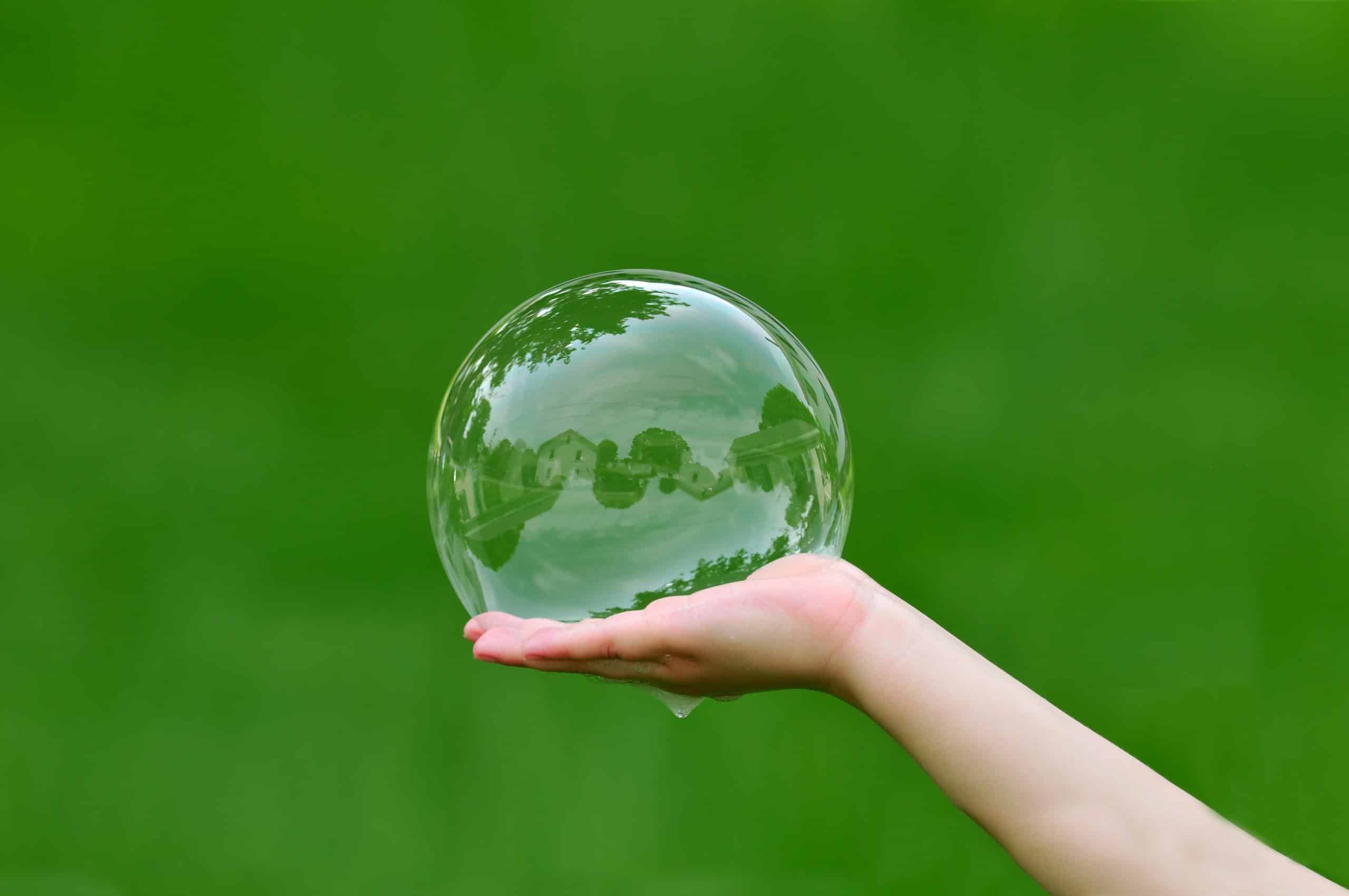 Photo of child holding a bubble representing team trust
