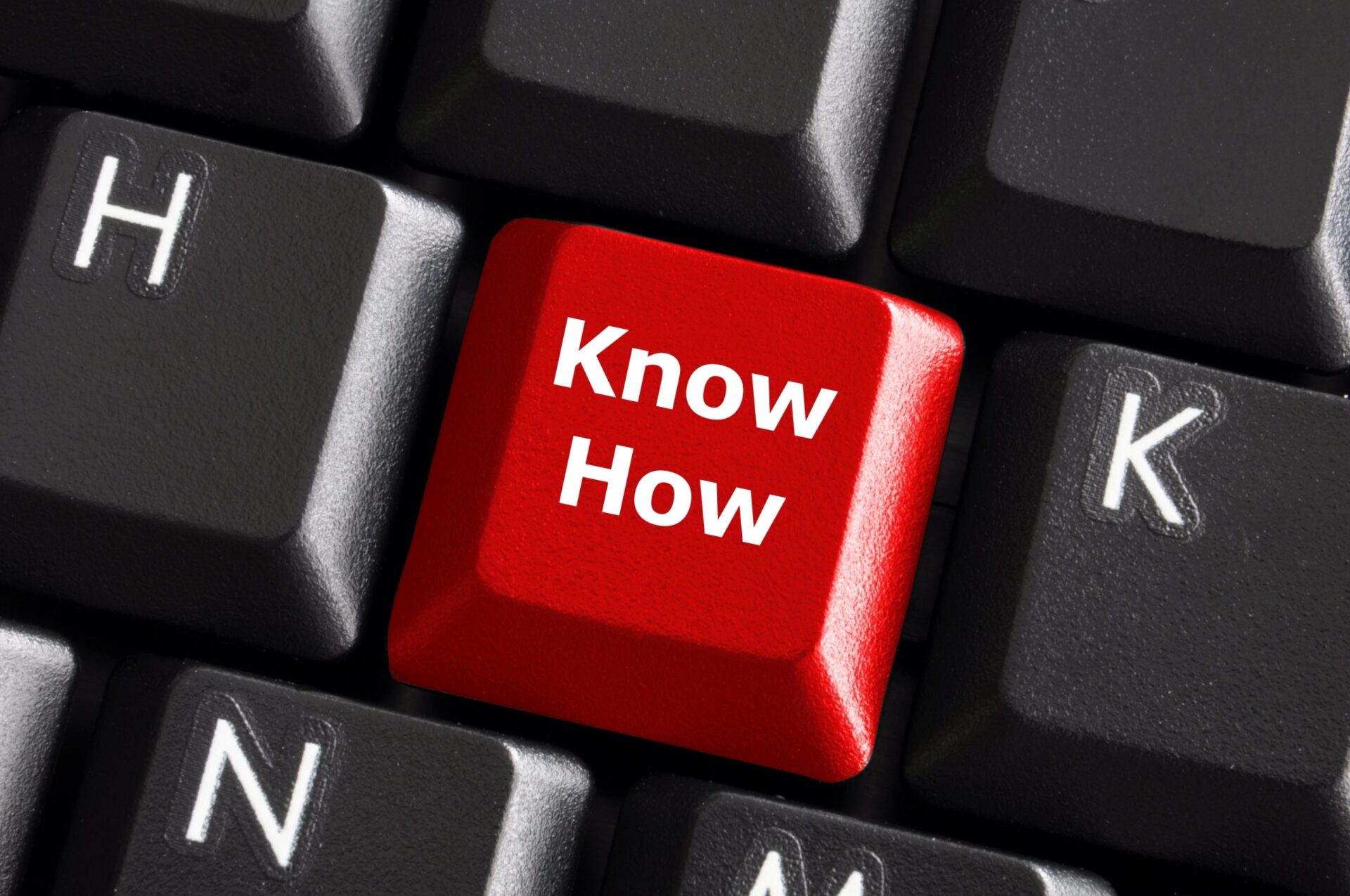 Photo of a keyboard key that says 'Know How'