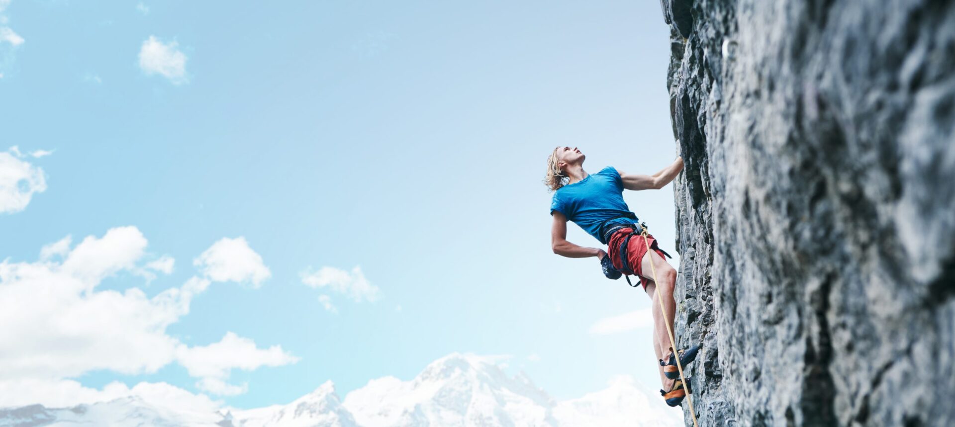 Photo of a lady rock climbing