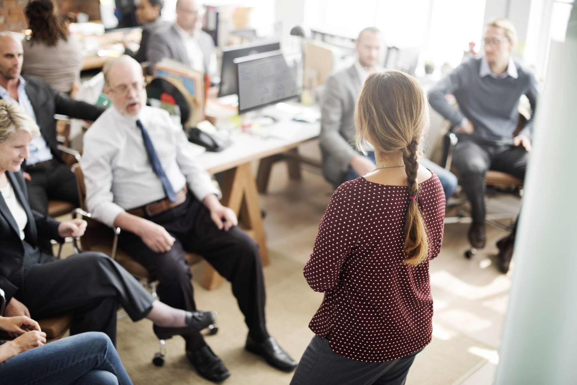 Photo of a team meeting at work being run by a women